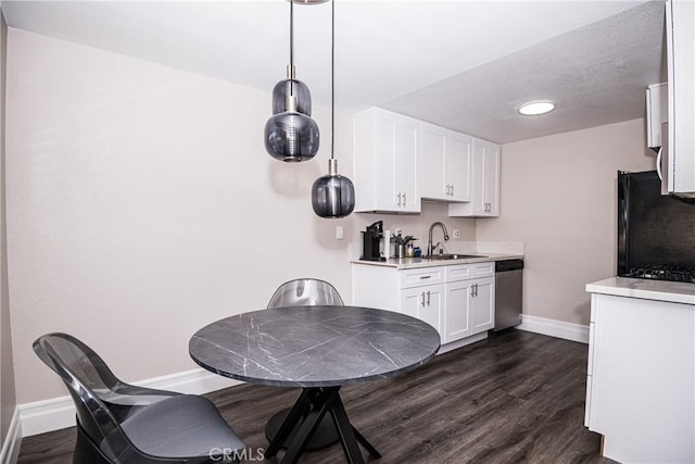 1000 Central Ave Unit 19, Riverside, CA 92507 - kitchen with black fridge, dishwasher, light countertops, and white cabinetry