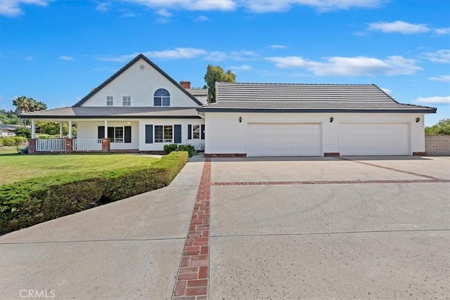 31655 Pio Pico Rd, Temecula, CA 92592 - view of front of property featuring a front lawn, a garage, driveway, and covered porch