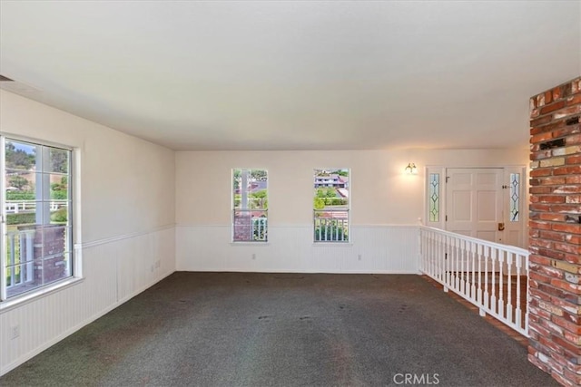 31655 Pio Pico Rd, Temecula, CA 92592 - unfurnished room featuring a wainscoted wall, healthy amount of natural light, and carpet floors