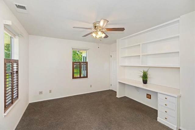 31655 Pio Pico Rd, Temecula, CA 92592 - unfurnished office with dark colored carpet, a ceiling fan, and built in desk