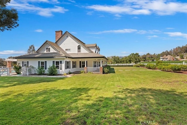 31655 Pio Pico Rd, Temecula, CA 92592 - rear view of property featuring a lawn, a chimney, and a tile roof