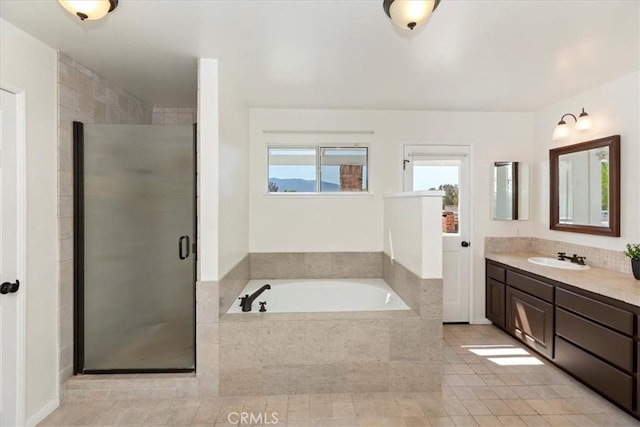 31655 Pio Pico Rd, Temecula, CA 92592 - bathroom with vanity, a garden tub, a stall shower, and tile patterned flooring