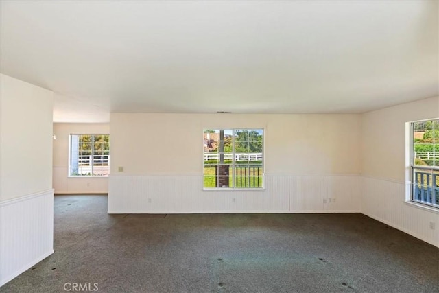 31655 Pio Pico Rd, Temecula, CA 92592 - unfurnished room with wainscoting and dark colored carpet