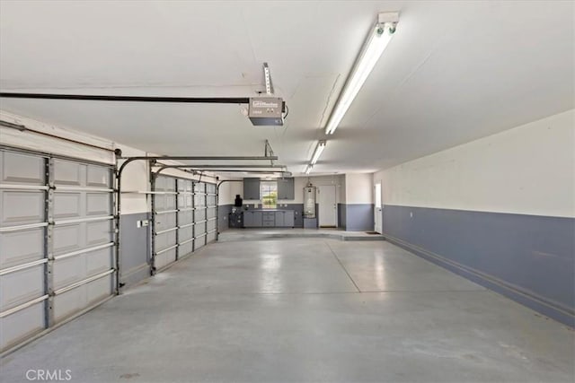 31655 Pio Pico Rd, Temecula, CA 92592 - garage with a garage door opener and baseboards
