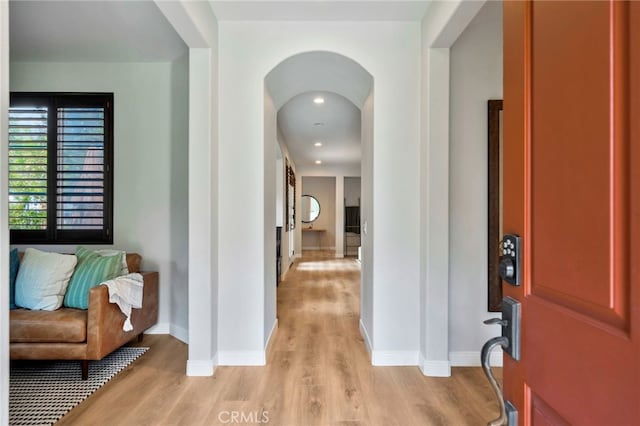 8 Caltrop Way, Ladera Ranch, CA 92694 - entryway with light wood-style floors and arched walkways