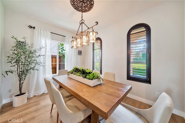 8 Caltrop Way, Ladera Ranch, CA 92694 - dining area with light wood finished floors and a chandelier