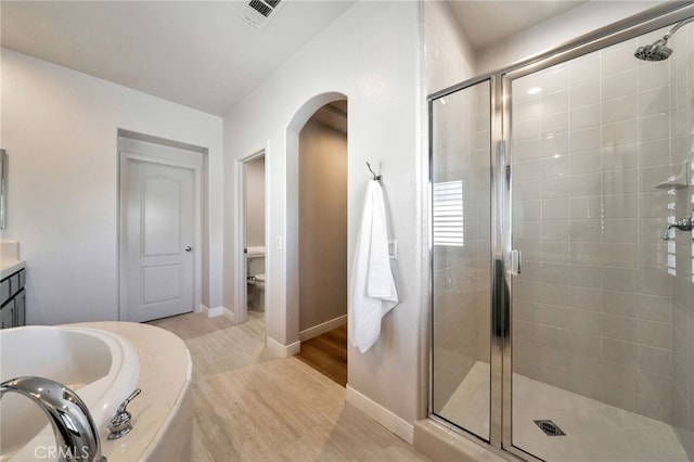 8 Caltrop Way, Ladera Ranch, CA 92694 - bathroom featuring a shower stall, a garden tub, and vanity