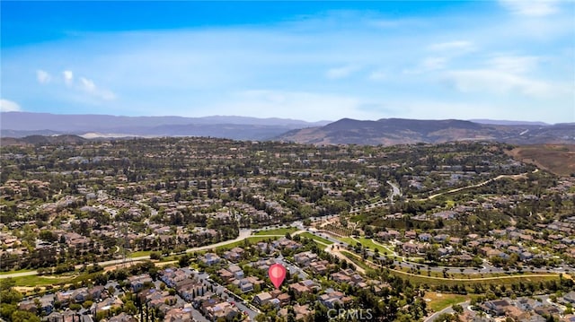 8 Caltrop Way, Ladera Ranch, CA 92694 - aerial overview of property's location with a mountain backdrop and nearby suburban area