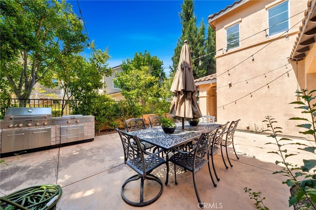8 Caltrop Way, Ladera Ranch, CA 92694 - view of patio / terrace with an outdoor kitchen and outdoor dining space