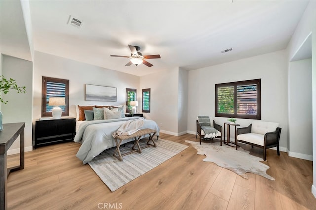 8 Caltrop Way, Ladera Ranch, CA 92694 - bedroom with multiple windows, light wood-style floors, and ceiling fan