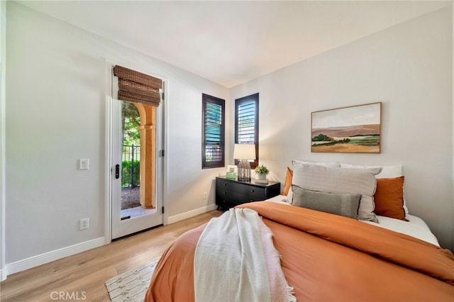 8 Caltrop Way, Ladera Ranch, CA 92694 - bedroom with access to outside, multiple windows, and light wood-style flooring