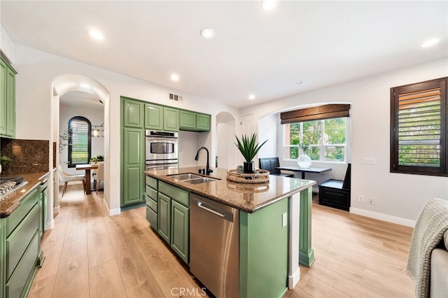 8 Caltrop Way, Ladera Ranch, CA 92694 - kitchen with green cabinets, appliances with stainless steel finishes, arched walkways, and recessed lighting