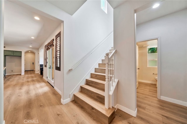 8 Caltrop Way, Ladera Ranch, CA 92694 - staircase with wood finished floors, arched walkways, and recessed lighting