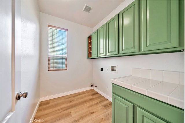 8 Caltrop Way, Ladera Ranch, CA 92694 - washroom with cabinet space, washer hookup, and light wood finished floors