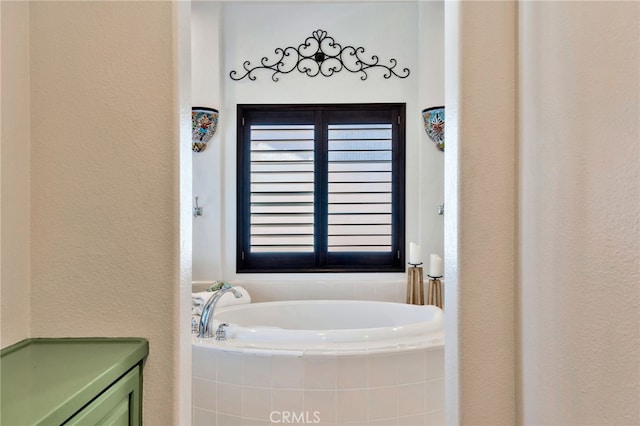 8 Caltrop Way, Ladera Ranch, CA 92694 - full bath featuring a bath, a textured wall, and healthy amount of natural light