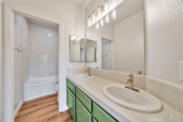 8 Caltrop Way, Ladera Ranch, CA 92694 - full bathroom with wood finished floors, double vanity, and shower / washtub combination