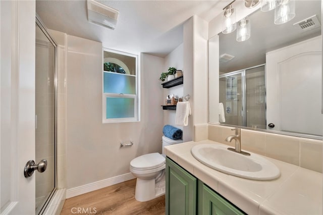 8 Caltrop Way, Ladera Ranch, CA 92694 - bathroom featuring wood finished floors, tiled shower, and vanity