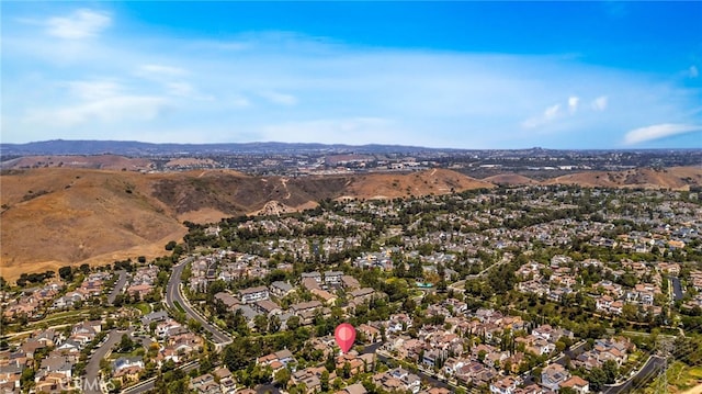 8 Caltrop Way, Ladera Ranch, CA 92694 - aerial view of property and surrounding area with nearby suburban area and a mountain backdrop