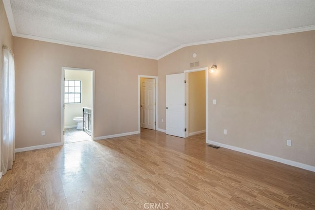 49750 Three Points Rd, Lancaster, CA 93536 - empty room with crown molding, light wood-style flooring, and vaulted ceiling