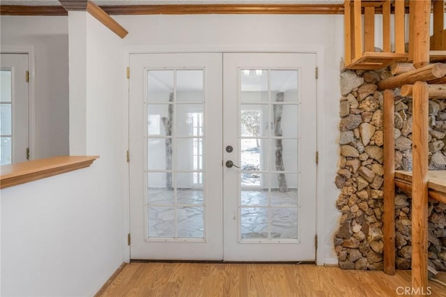 49750 Three Points Rd, Lancaster, CA 93536 - doorway with french doors, light wood finished floors, and ornamental molding
