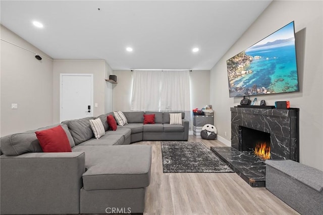 7550 Periwinkle Dr, Fontana, CA 92336 - living area featuring wood finished floors, recessed lighting, and a fireplace