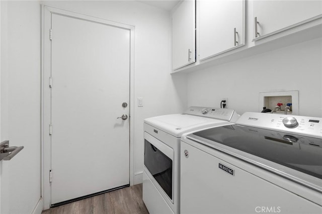 7550 Periwinkle Dr, Fontana, CA 92336 - washroom featuring cabinet space, washing machine and clothes dryer, and wood finished floors