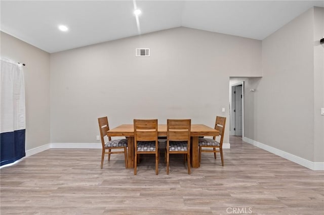 7550 Periwinkle Dr, Fontana, CA 92336 - dining room with light wood-style flooring, lofted ceiling, and recessed lighting