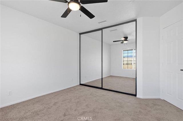 9191 White Rd, Phelan, CA 92371 - unfurnished bedroom with carpet, a closet, and ceiling fan