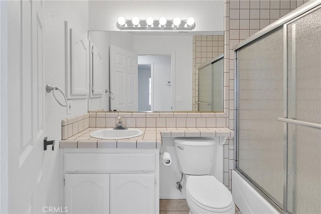 9191 White Rd, Phelan, CA 92371 - bathroom with vanity and bath / shower combo with glass door