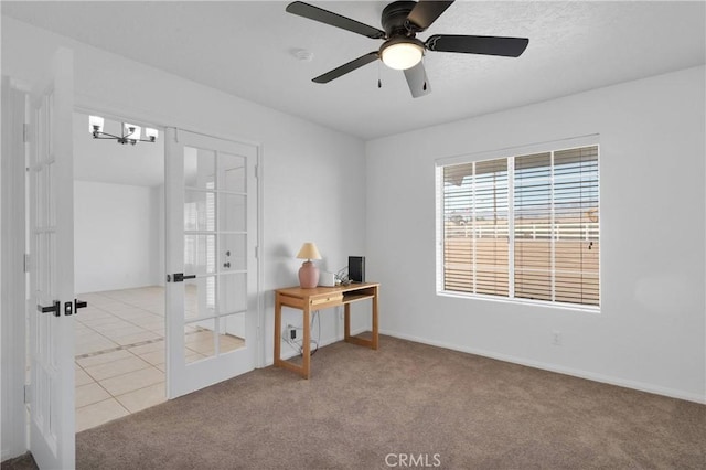 9191 White Rd, Phelan, CA 92371 - carpeted spare room with a smoke detector, a ceiling fan, and french doors