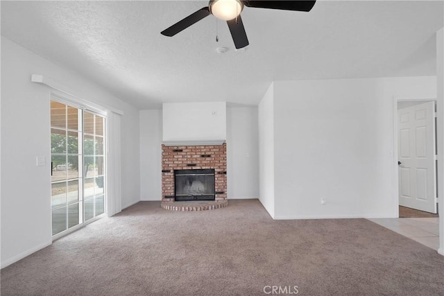 9191 White Rd, Phelan, CA 92371 - unfurnished living room with carpet, ceiling fan, and a brick fireplace