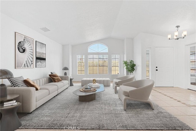 9191 White Rd, Phelan, CA 92371 - living room featuring lofted ceiling, a chandelier, tile patterned floors, and a textured ceiling