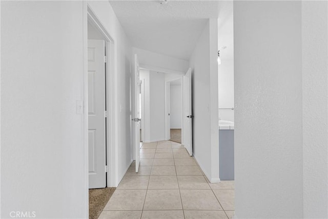 9191 White Rd, Phelan, CA 92371 - hall with light tile patterned floors and baseboards