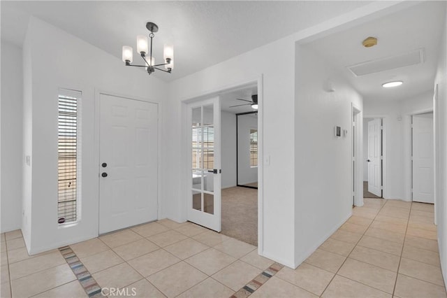 9191 White Rd, Phelan, CA 92371 - entryway featuring light tile patterned flooring and a chandelier