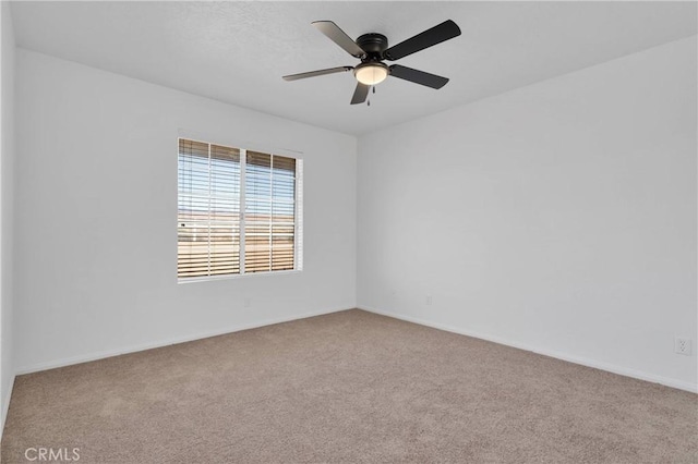 9191 White Rd, Phelan, CA 92371 - carpeted empty room with baseboards and a ceiling fan