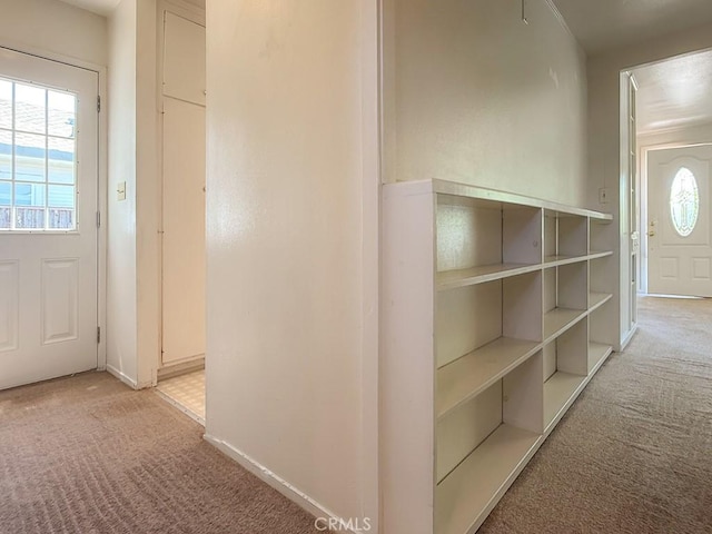 569 Huntington Rd, Cambria, CA 93428 - corridor with light colored carpet and healthy amount of natural light