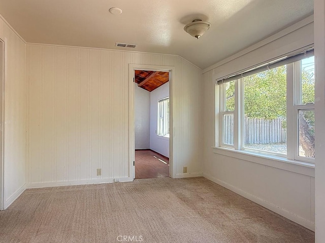 569 Huntington Rd, Cambria, CA 93428 - carpeted spare room with vaulted ceiling and baseboards