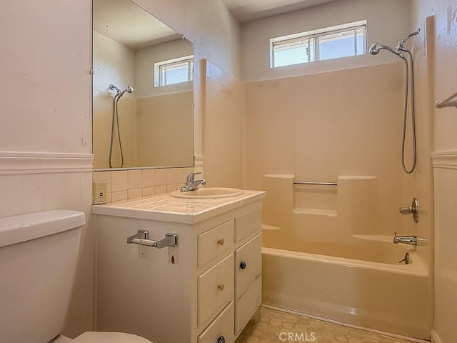 569 Huntington Rd, Cambria, CA 93428 - bathroom with a wainscoted wall, vanity, and washtub / shower combination