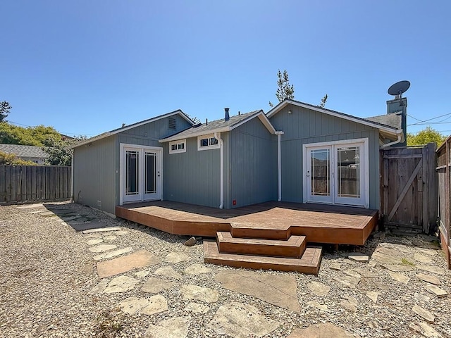 569 Huntington Rd, Cambria, CA 93428 - rear view of property with french doors, a fenced backyard, and a deck