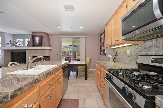 11180 Bridgefield Ct, Riverside, CA 92505 - kitchen with appliances with stainless steel finishes, backsplash, light tile patterned floors, recessed lighting, and light brown cabinetry