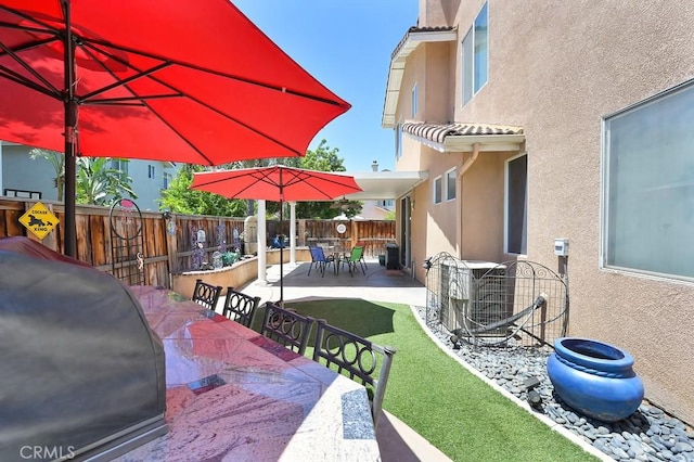 11180 Bridgefield Ct, Riverside, CA 92505 - fenced backyard with outdoor dining area and a patio area