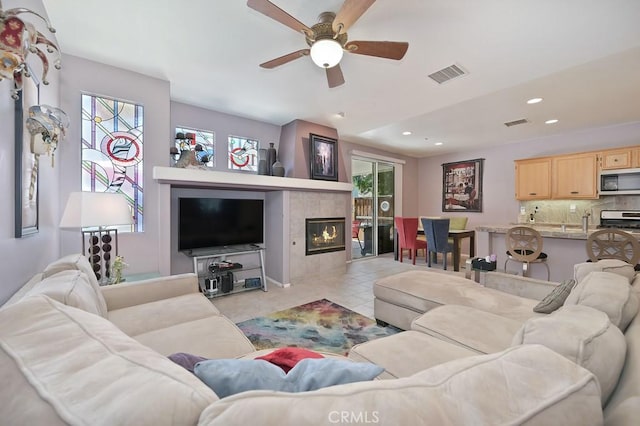 11180 Bridgefield Ct, Riverside, CA 92505 - living room featuring plenty of natural light, ceiling fan, recessed lighting, and a tile fireplace