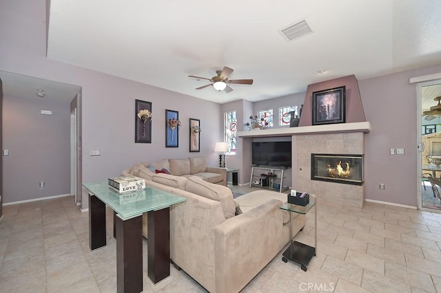 11180 Bridgefield Ct, Riverside, CA 92505 - living area with ceiling fan and a tiled fireplace