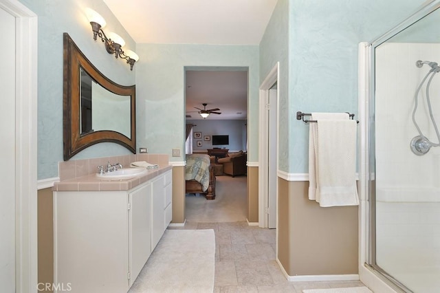 11180 Bridgefield Ct, Riverside, CA 92505 - bathroom featuring a ceiling fan, a shower stall, vanity, and connected bathroom