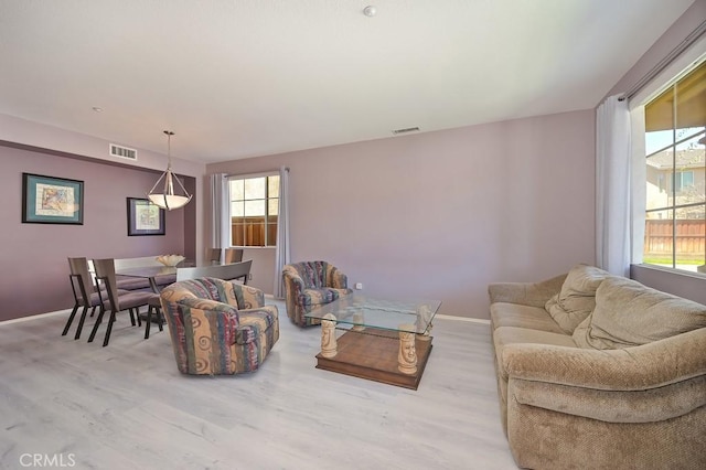 11180 Bridgefield Ct, Riverside, CA 92505 - living room with wood finished floors and baseboards