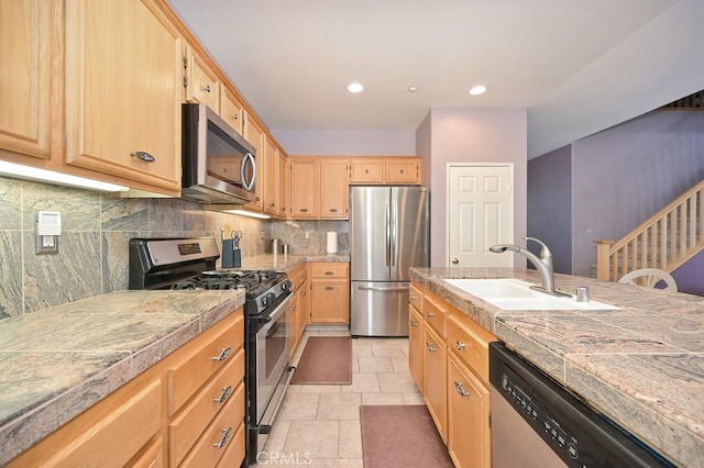 11180 Bridgefield Ct, Riverside, CA 92505 - kitchen with stainless steel appliances, light brown cabinets, tasteful backsplash, recessed lighting, and tile counters