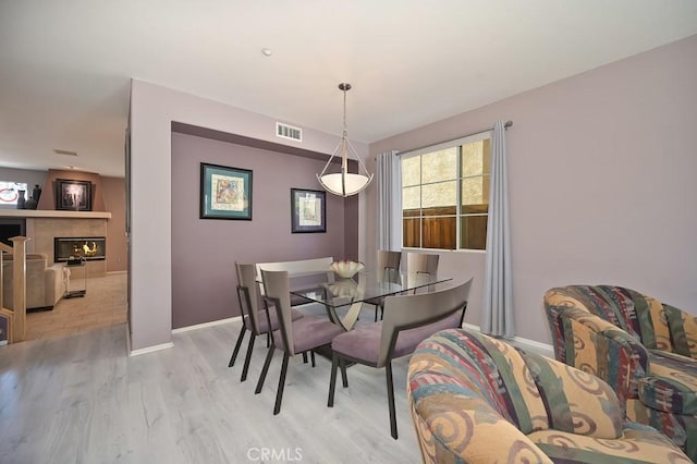 11180 Bridgefield Ct, Riverside, CA 92505 - dining area featuring light wood-style flooring and baseboards