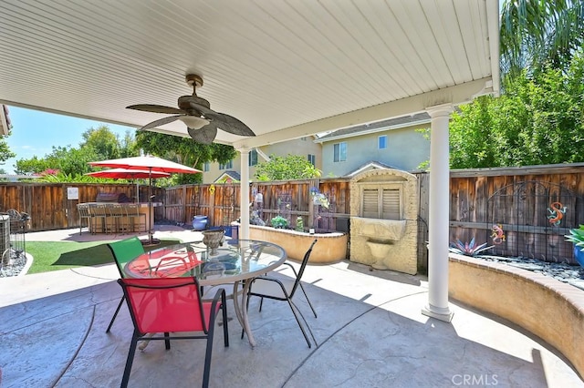 11180 Bridgefield Ct, Riverside, CA 92505 - fenced backyard with a patio, outdoor dining area, and a ceiling fan