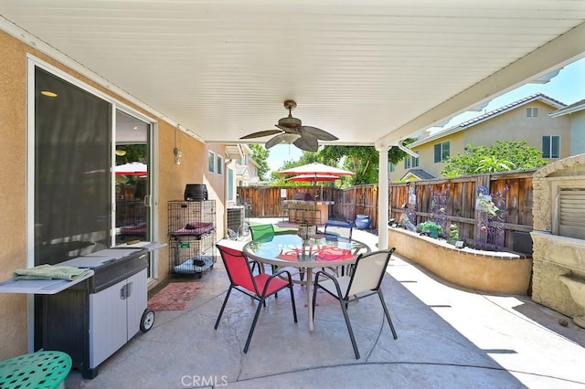 11180 Bridgefield Ct, Riverside, CA 92505 - fenced backyard with outdoor dining space, a patio, and a ceiling fan