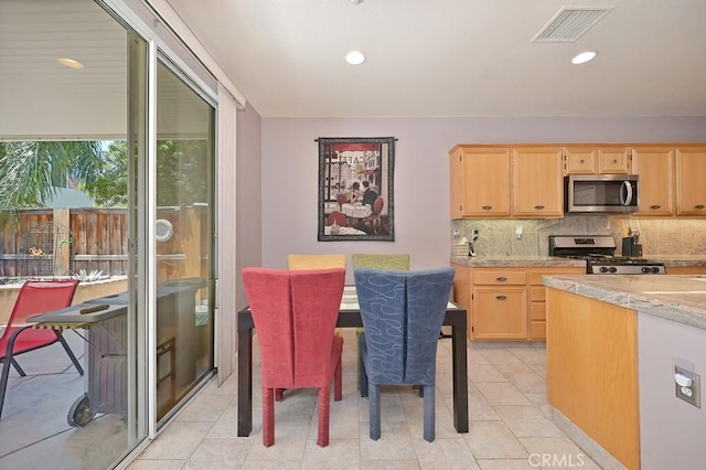 11180 Bridgefield Ct, Riverside, CA 92505 - kitchen featuring stainless steel appliances, light brown cabinets, tasteful backsplash, light tile patterned flooring, and recessed lighting